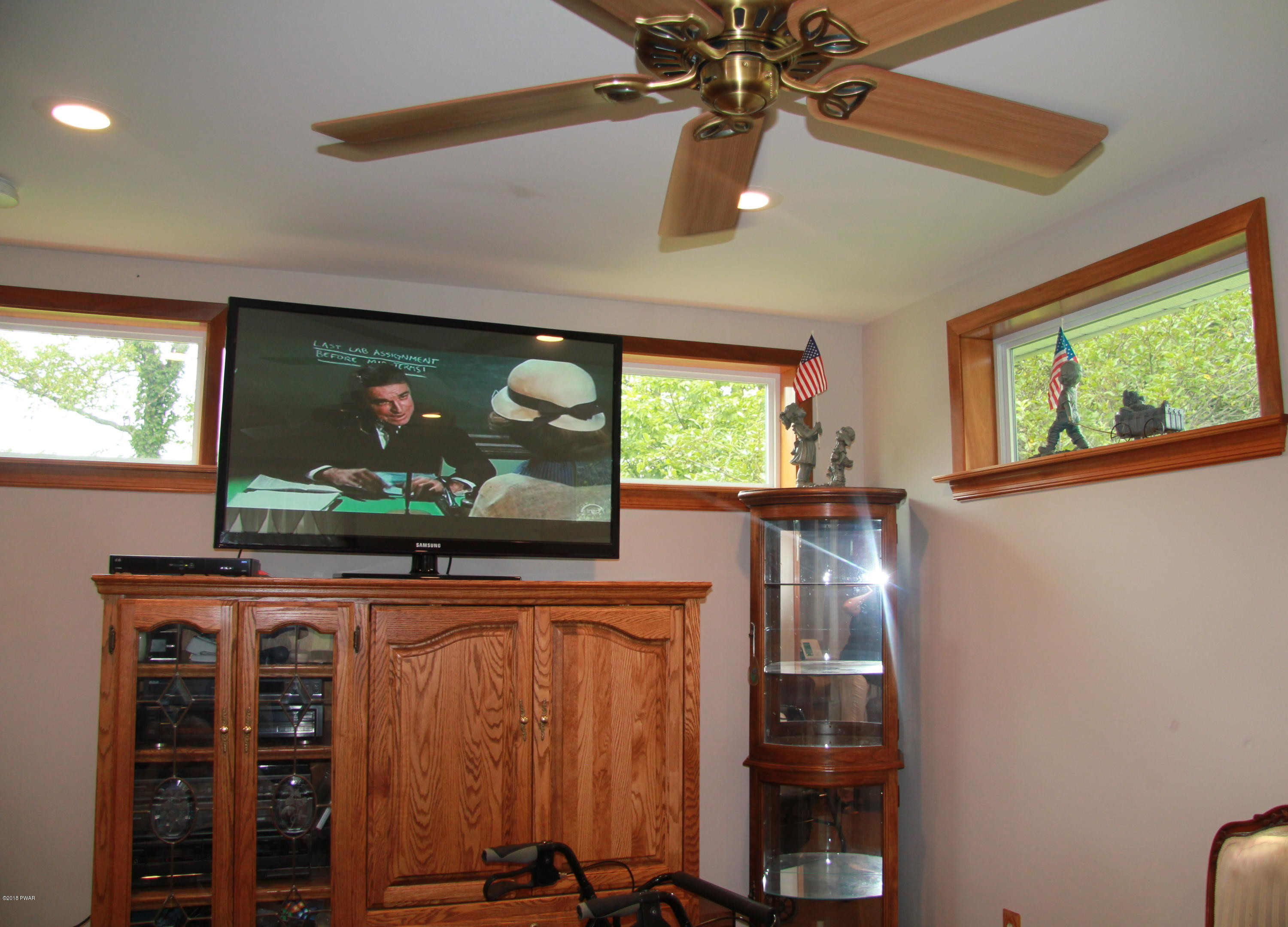 183 J J Road Moscow, PA 18444 - Photo 10 of 16 a living room with furniture and a flat screen tv