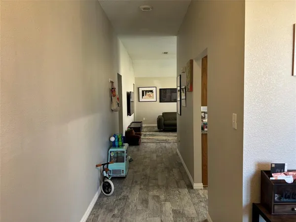 a view of a hallway with seating area