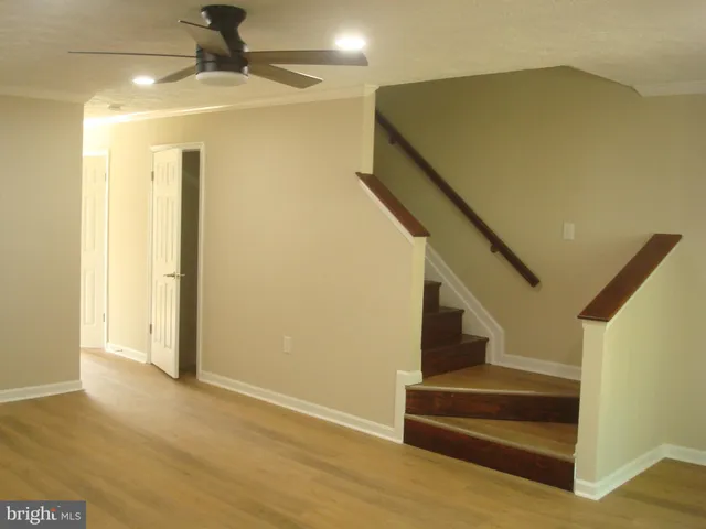 a view of room with window and hardwood floor