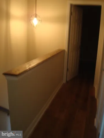 a view of door with wooden floor