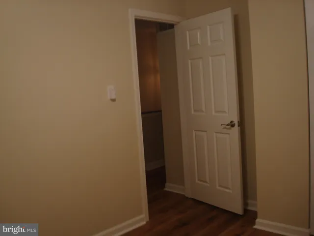 a bathroom with a sink double vanity granite tub shower and a mirror