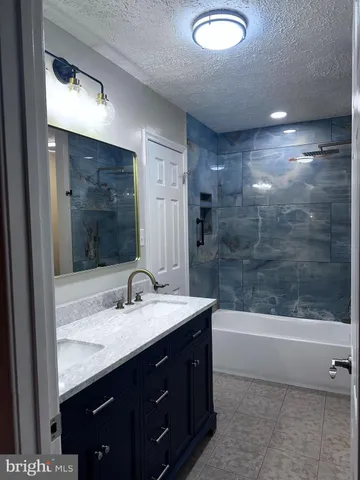 a bathroom with a sink and mirror