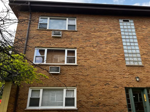a building view with a brick wall