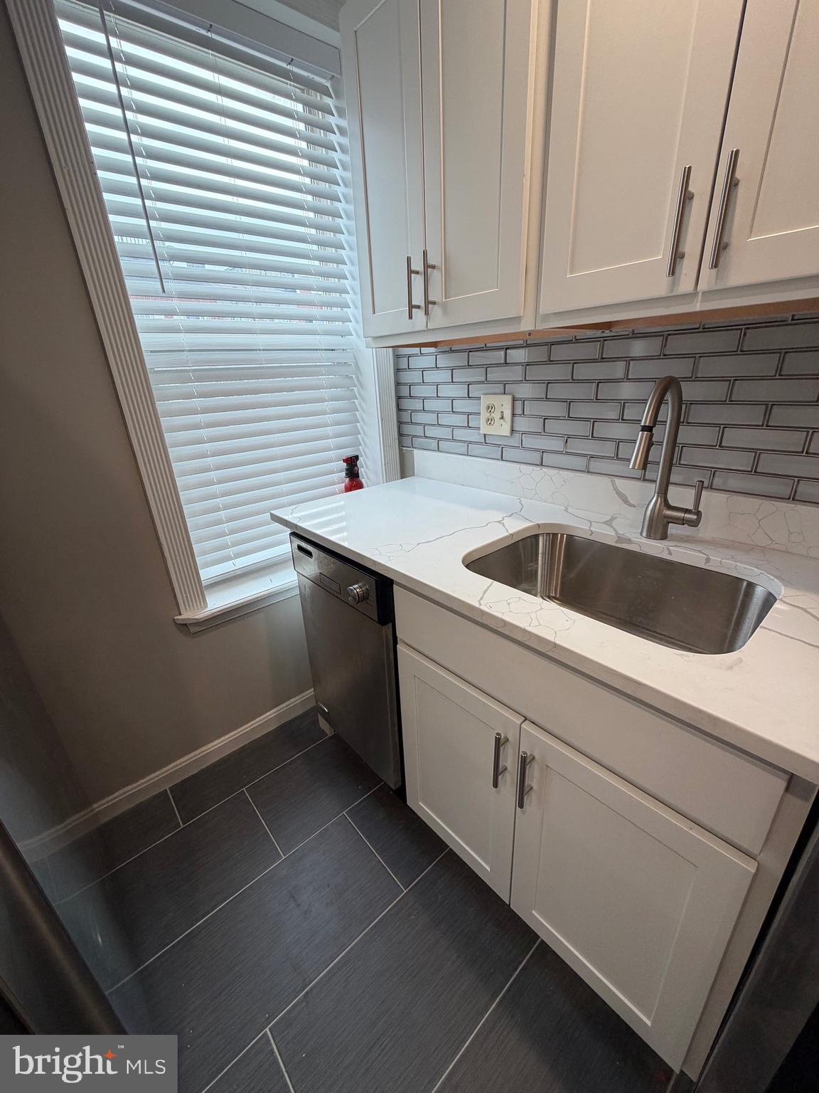 1458 Riverside Avenue, Unit 2B Baltimore, MD 21230 - Photo 5 of 16 a kitchen with a sink and cabinets