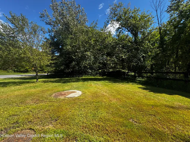 a view of a swimming pool with an outdoor space and seating area