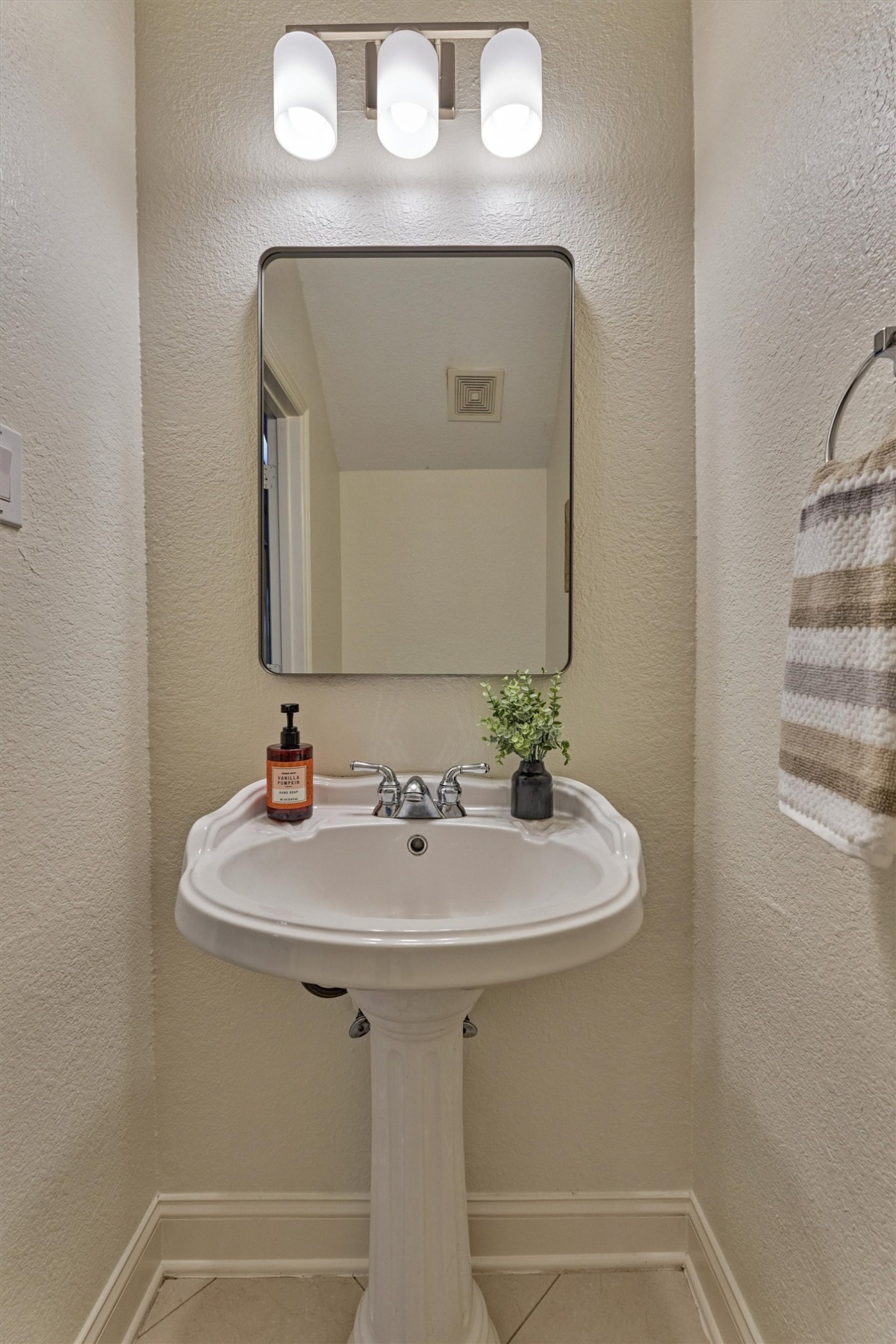 20938 Thistleberry Lane Spring, TX 77379 - Photo 11 of 45 Half Bath with pedestal sink and updated lights and mirror.