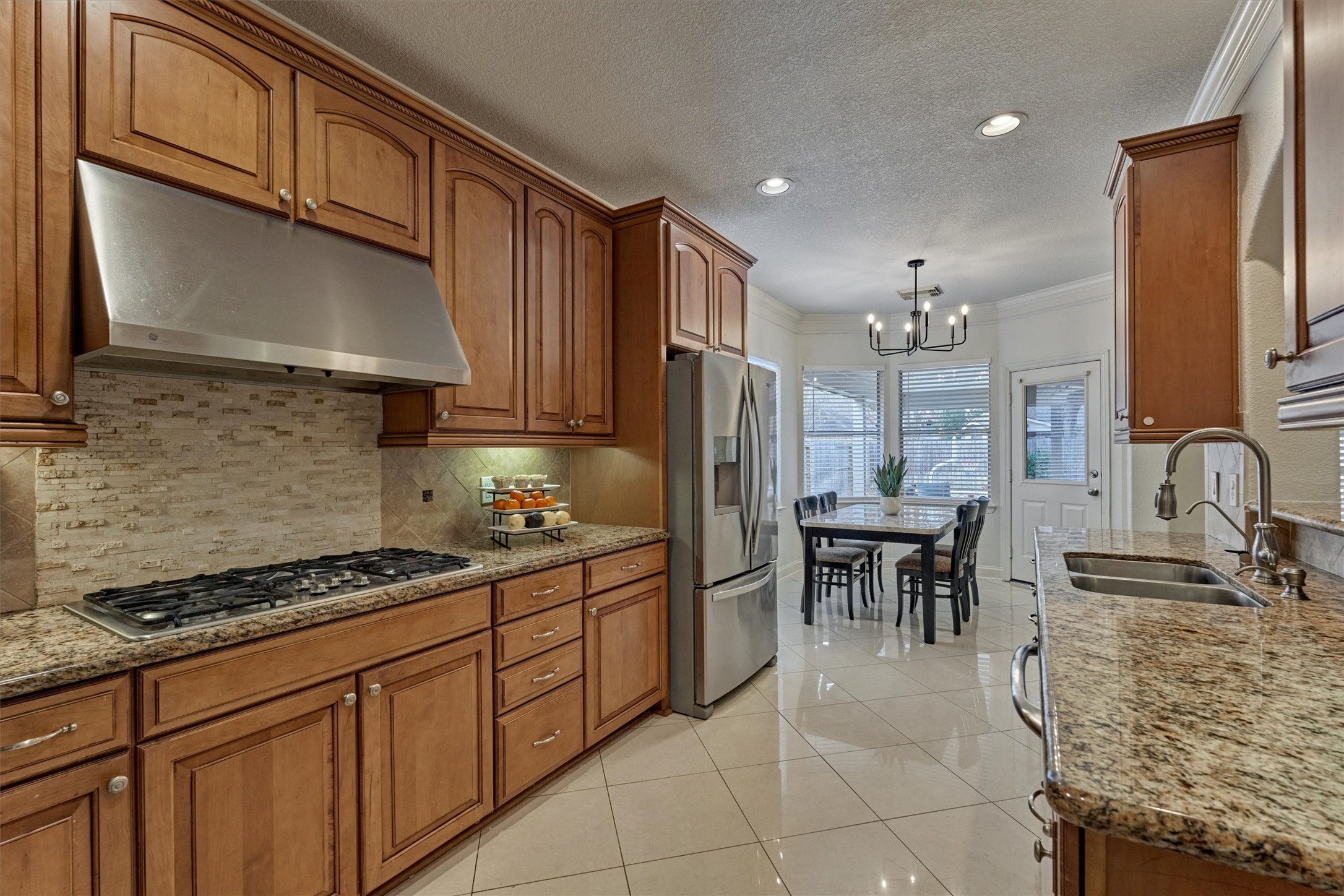 20938 Thistleberry Lane Spring, TX 77379 - Photo 15 of 45 Gas cooktop with ample counters for prepping meals.