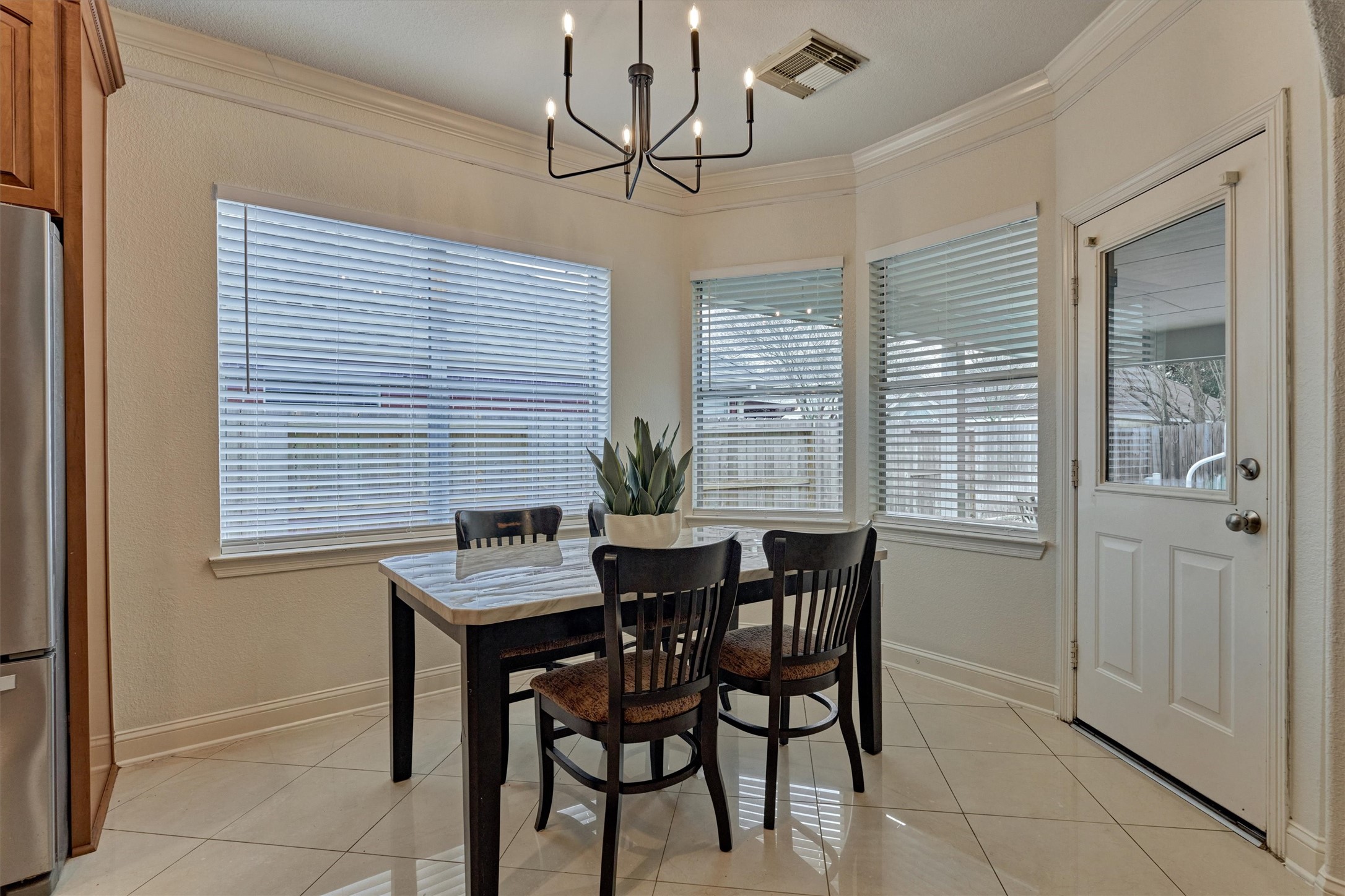 20938 Thistleberry Lane Spring, TX 77379 - Photo 17 of 45 Breakfast area surrounded by windows brings in beautiful natural light and view of backyard paradise.