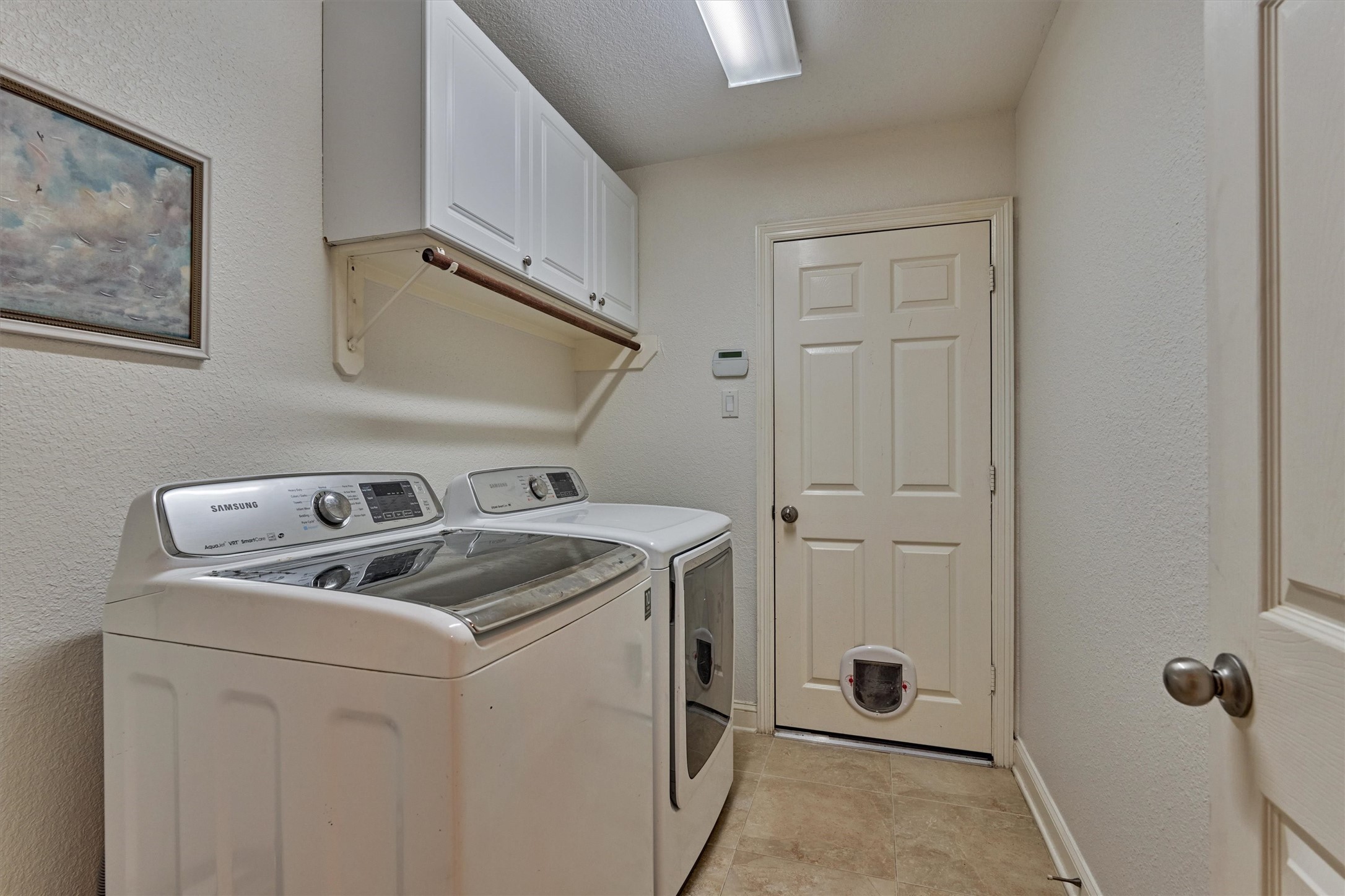 20938 Thistleberry Lane Spring, TX 77379 - Photo 21 of 45 Spacious laundry area with door leading to garage.