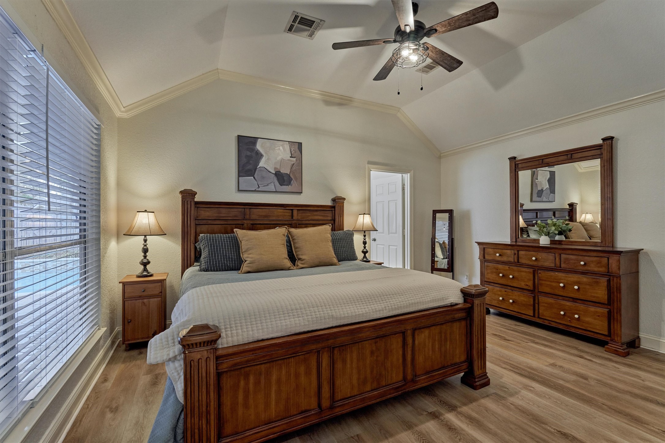 20938 Thistleberry Lane Spring, TX 77379 - Photo 22 of 45 Primary suite with high ceiling and windows overlooking backyard paradise.