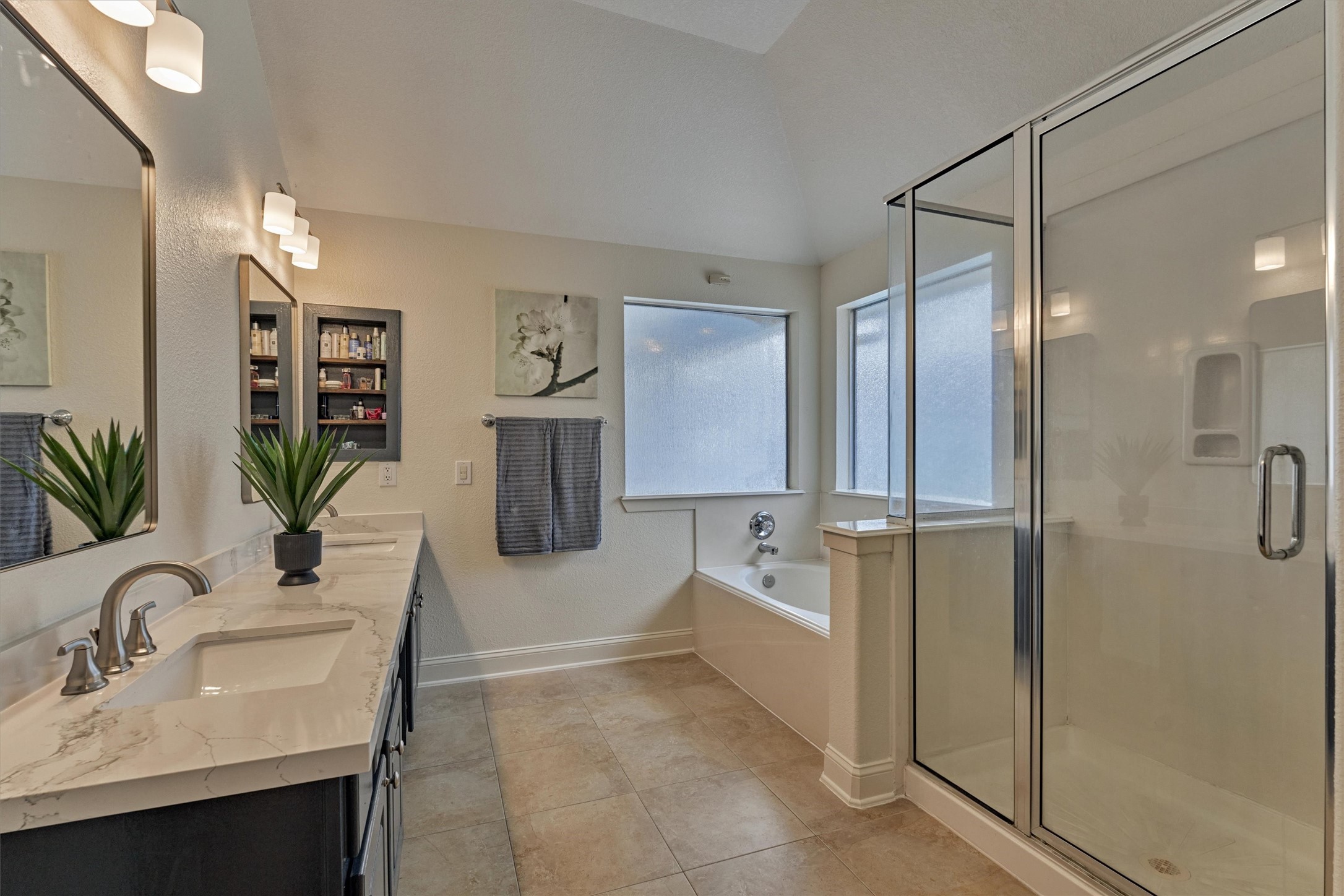 20938 Thistleberry Lane Spring, TX 77379 - Photo 24 of 45 Primary Bath recently refreshed with quartz counters, sinks, lighting and mirrors.