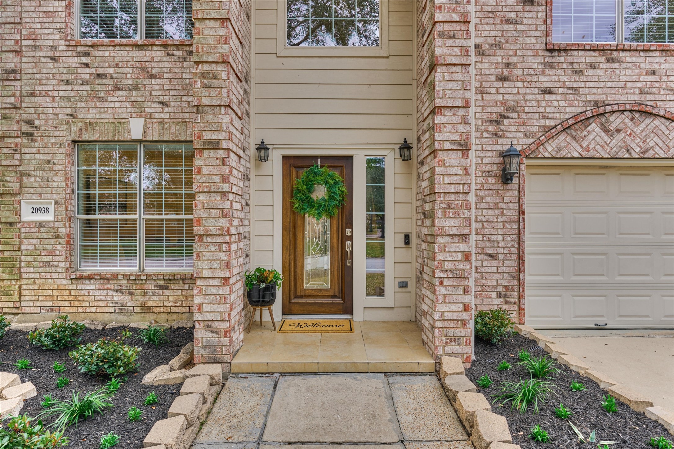 20938 Thistleberry Lane Spring, TX 77379 - Photo 6 of 45 Beautiful tiled front porch sets the tone for a warm welcome for guests.