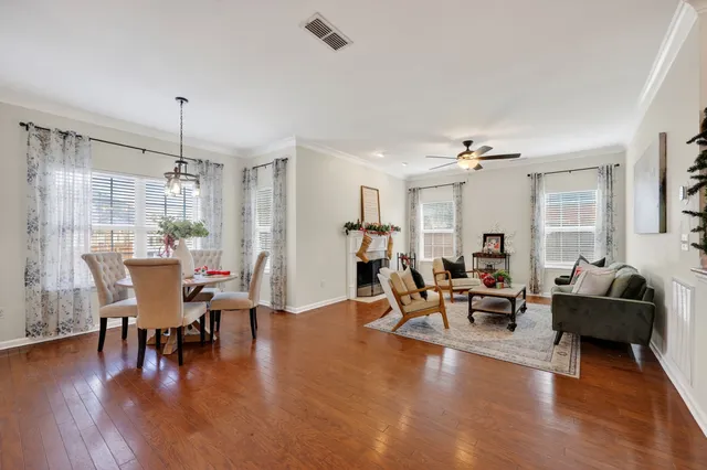 a view of a livingroom with a window and a ceiling fan