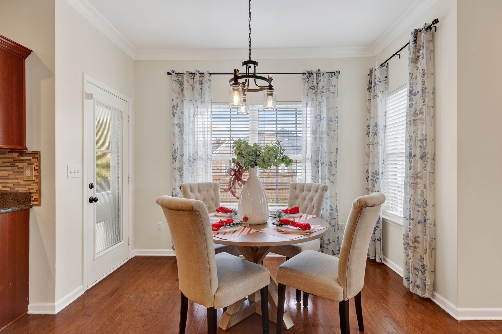 4093 Locerbie Circle Spring Hill, TN 37174 - Photo 14 of 51 a view of a dining room with furniture window and wooden floor