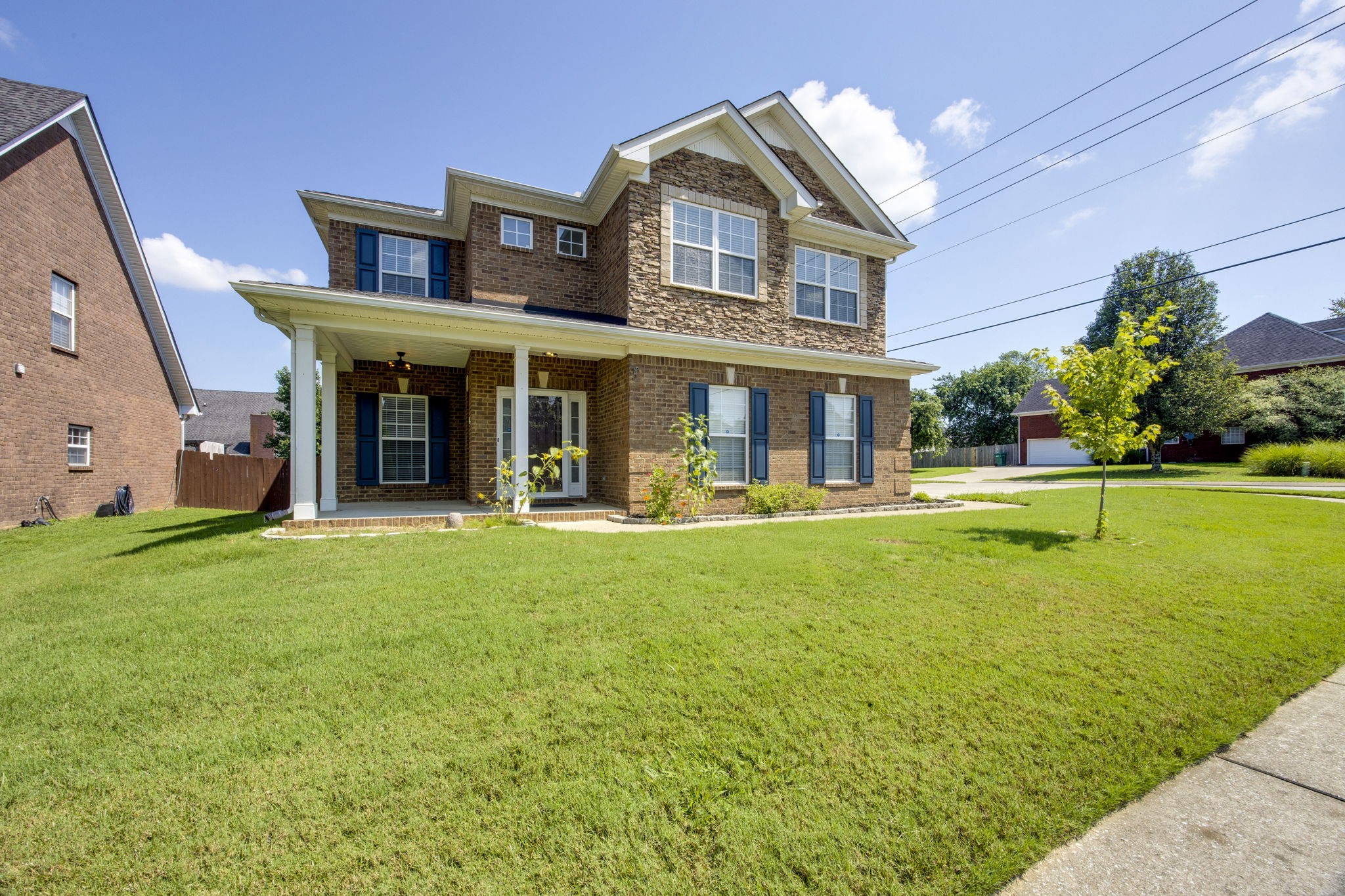 4093 Locerbie Circle Spring Hill, TN 37174 - Photo 3 of 51 a front view of a house with swimming pool having outdoor seating
