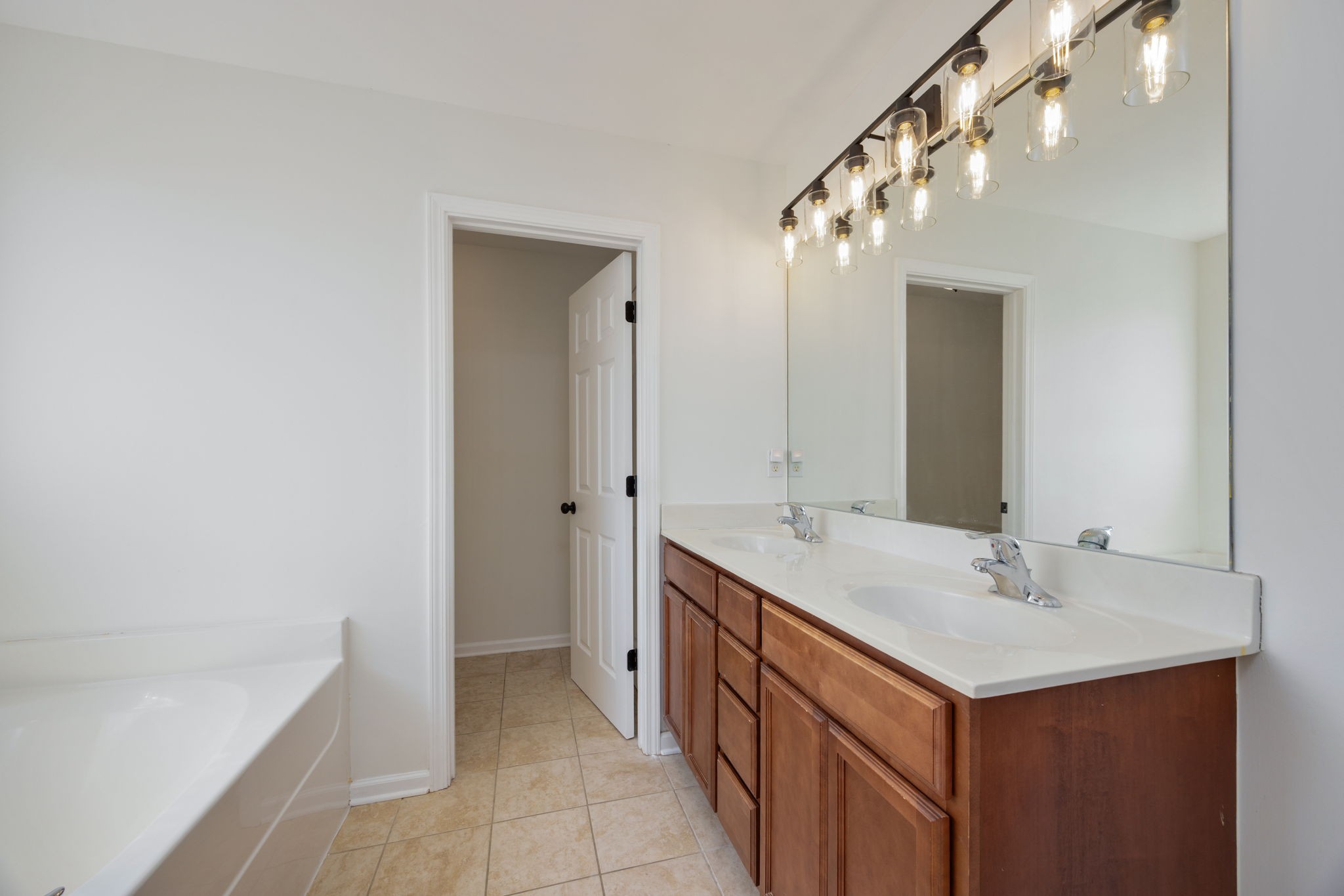 4093 Locerbie Circle Spring Hill, TN 37174 - Photo 35 of 51 a bathroom with a sink and a mirror