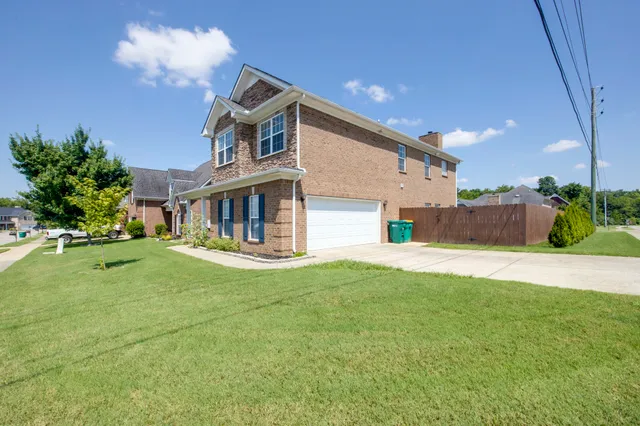 a dining room with furniture window and wooden floor