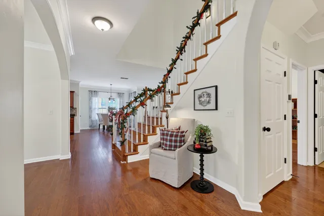 a view of a workspace with furniture and wooden floor
