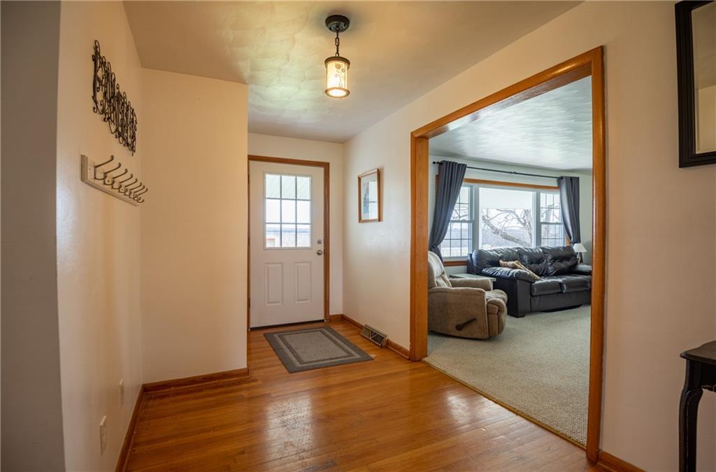 Large entry foyer with hardwood floors. 
