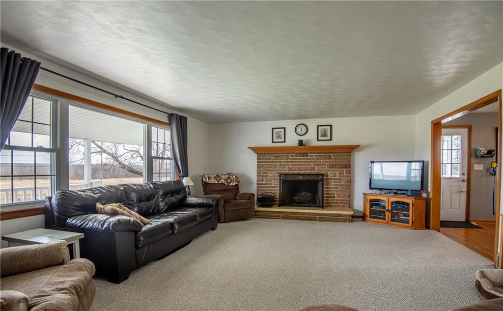 Spacious living room with fireplace. 