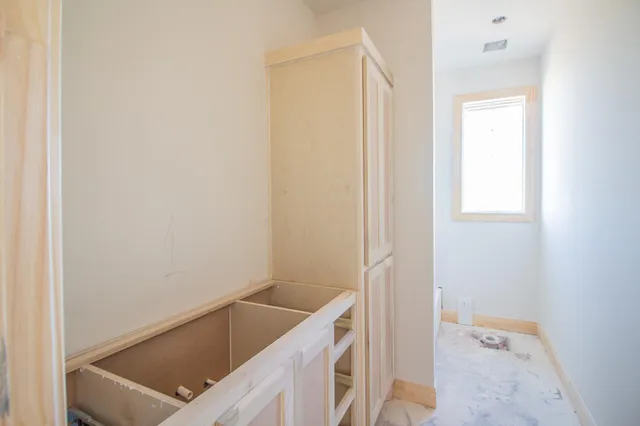 a bathroom with a tub and sink