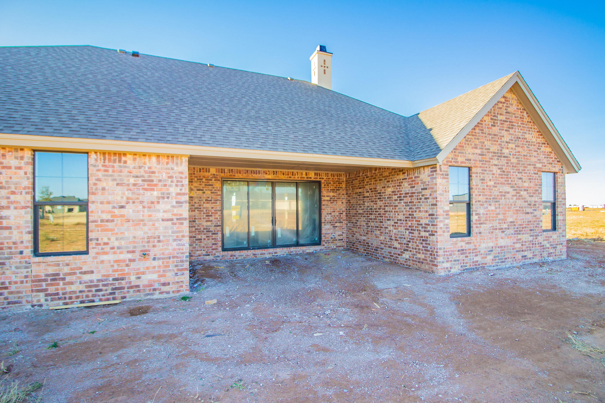 309 Juniper New Home, TX 79381 - Photo 23 of 24 a view of a house with a street