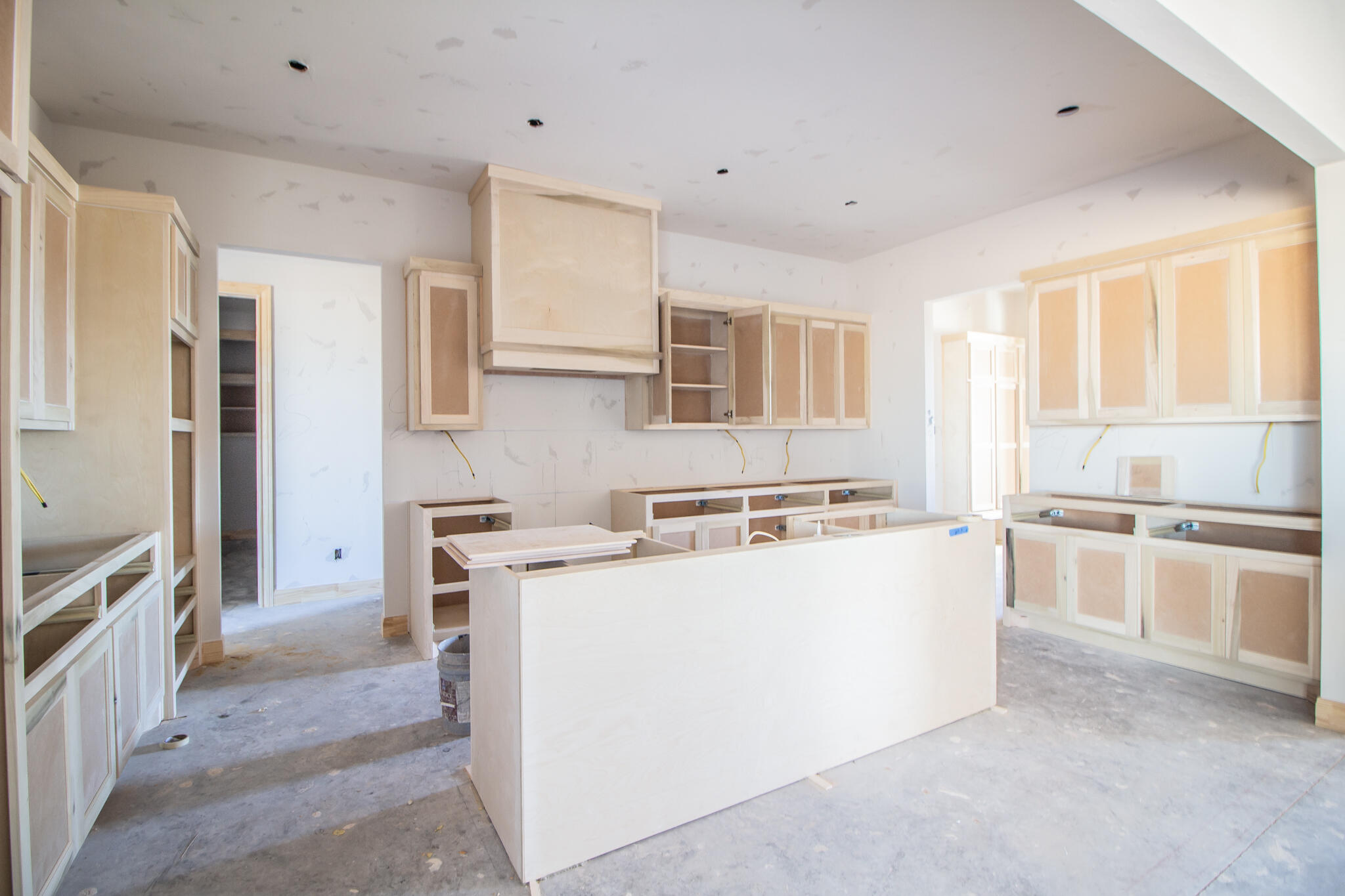 309 Juniper New Home, TX 79381 - Photo 9 of 24 a kitchen with a stove a refrigerator and white cabinets