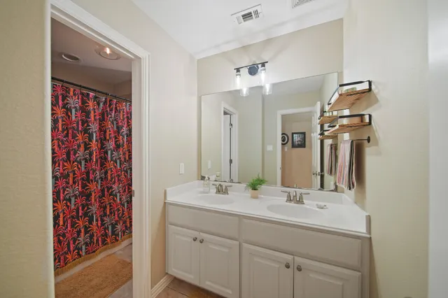 a view of a chair and table in the garden