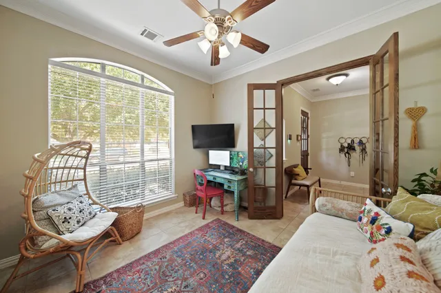 a living room with furniture and a window