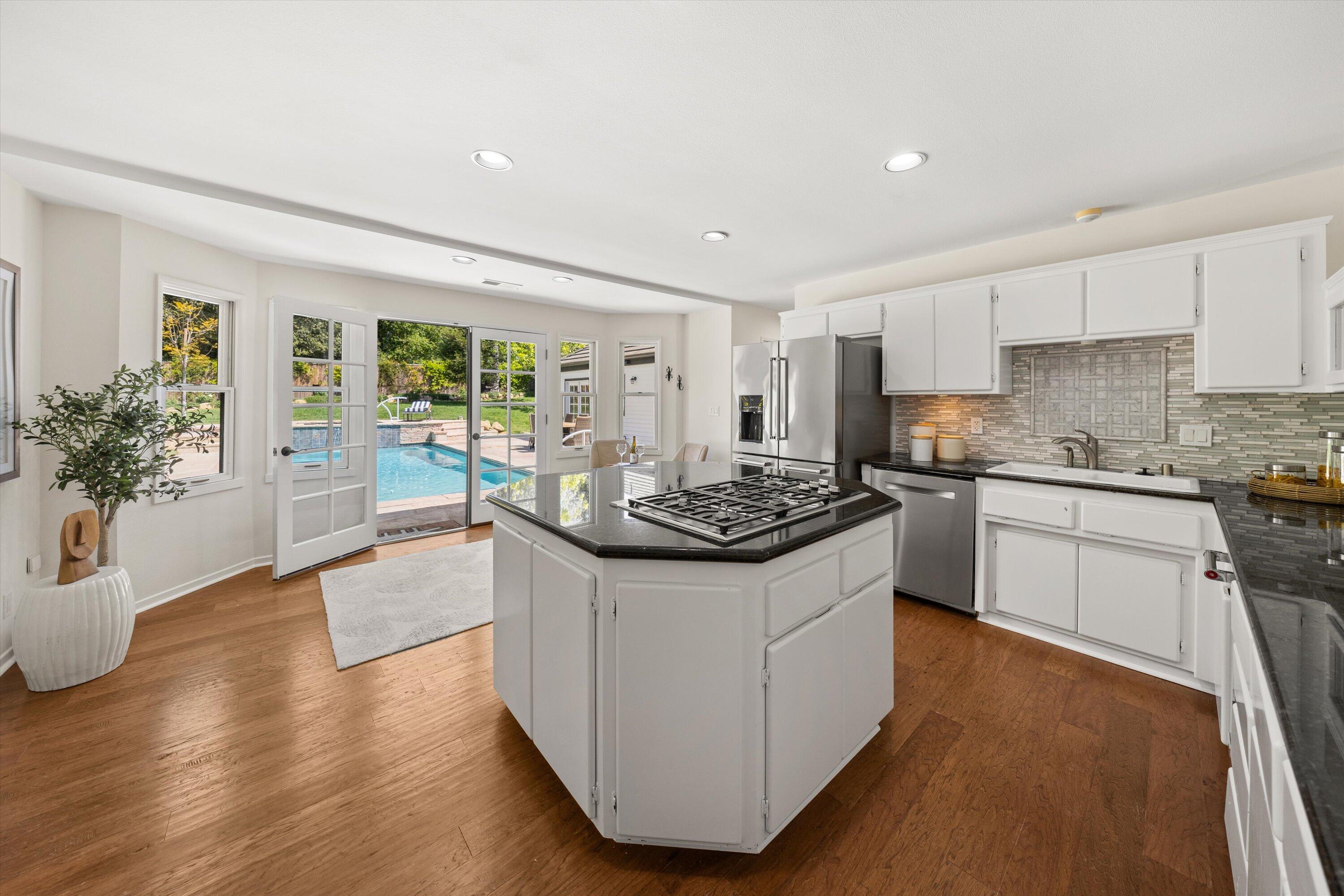 4530 Via Clarice Santa Barbara, CA 93111 - Photo 11 of 28 a kitchen with a sink and a stove top oven