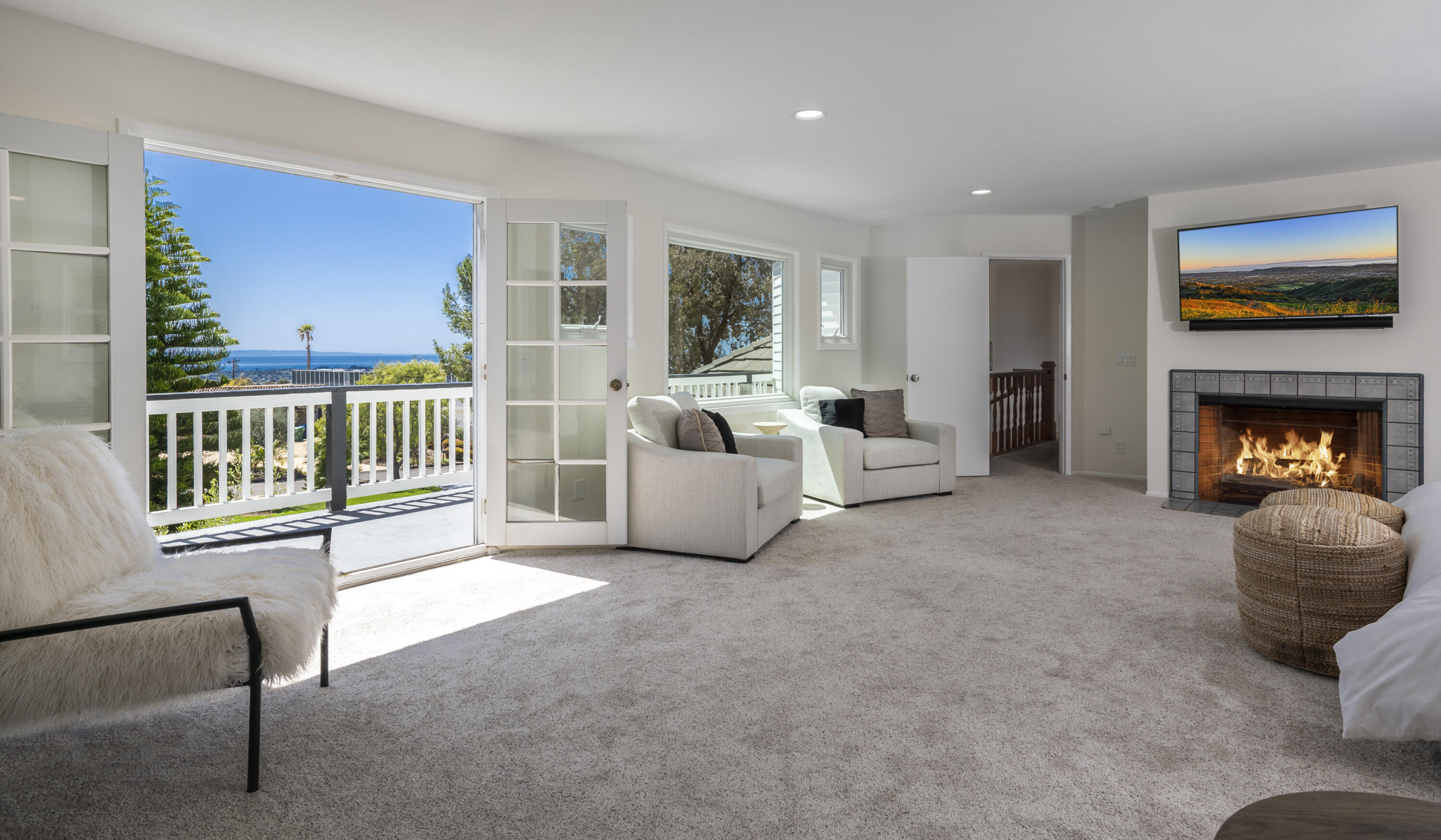 4530 Via Clarice Santa Barbara, CA 93111 - Photo 17 of 28 a living room with furniture and a fireplace