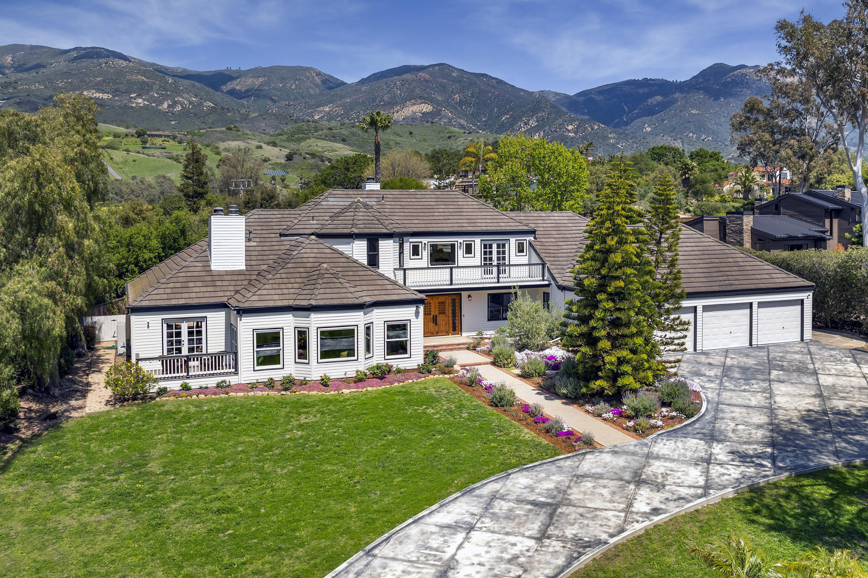 4530 Via Clarice Santa Barbara, CA 93111 - Photo 2 of 28 a front view of a house with a garden and a yard