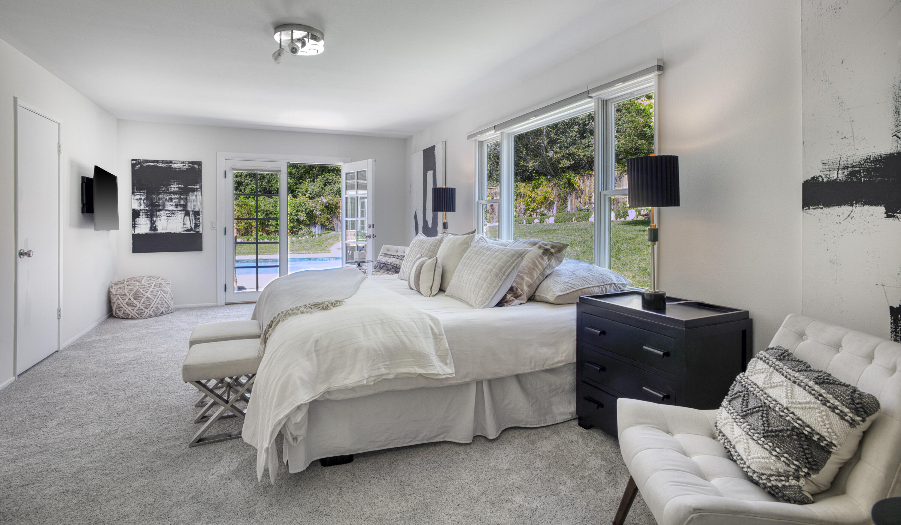 4530 Via Clarice Santa Barbara, CA 93111 - Photo 22 of 28 a bedroom with a bed and a flat screen tv