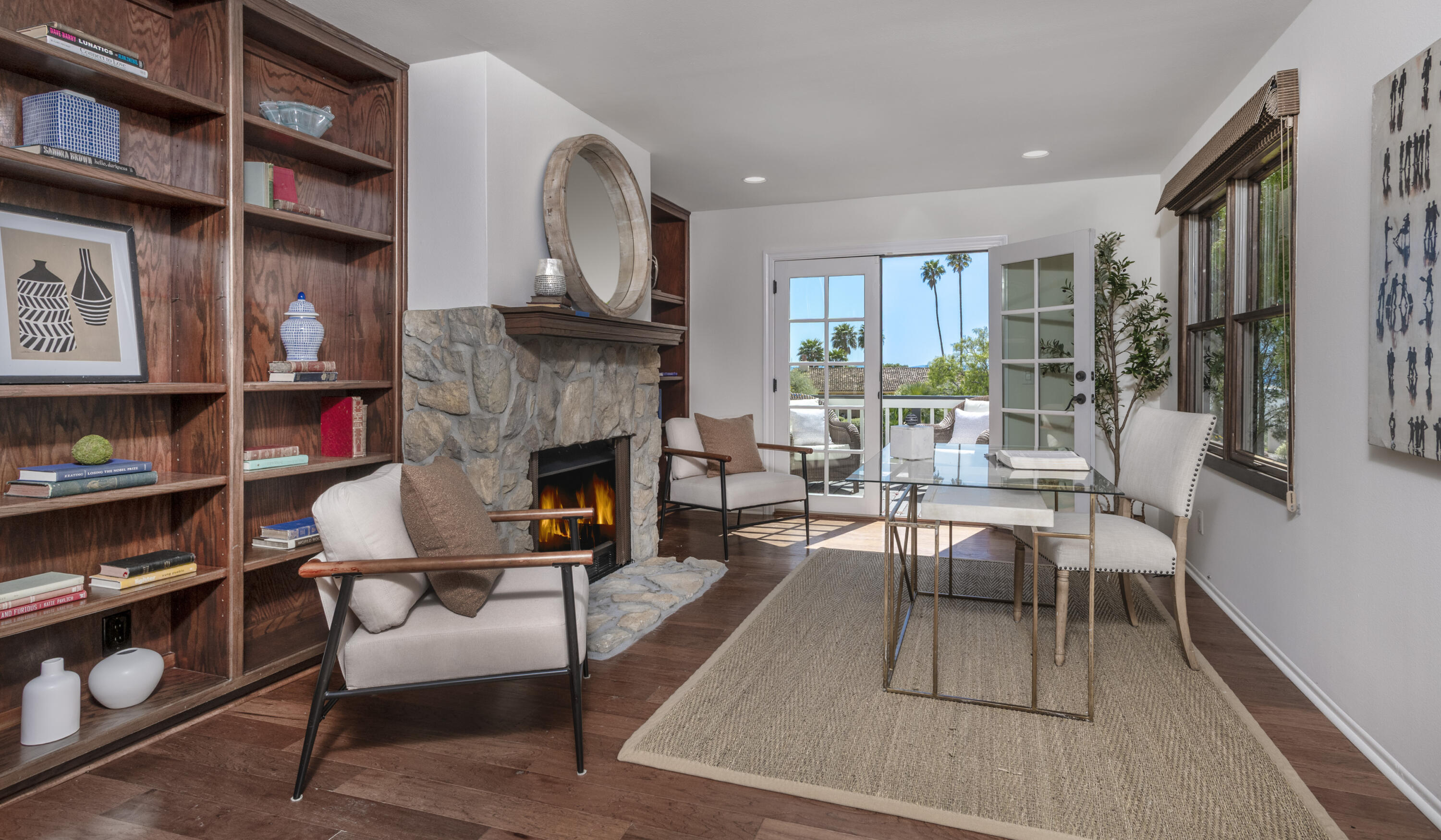 4530 Via Clarice Santa Barbara, CA 93111 - Photo 10 of 28 a living room with furniture a fireplace and a large window