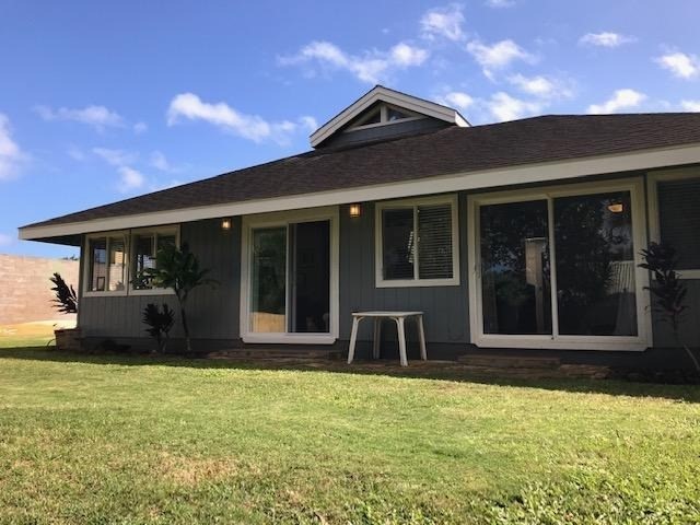 front view of a house with a yard