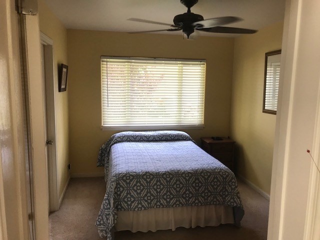 6050 Kapahi Road, Unit B Kapaa, HI 96746 - Photo 12 of 29 a bedroom with a bed and a window