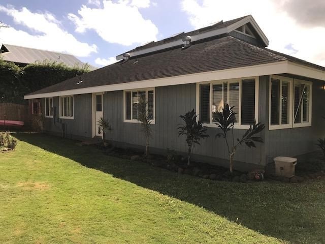 6050 Kapahi Road, Unit B Kapaa, HI 96746 - Photo 22 of 29 a backyard of a house with yard table and chairs