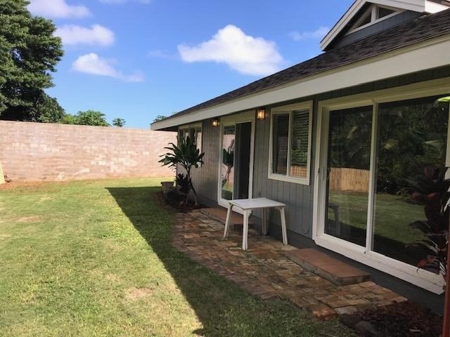 6050 Kapahi Road, Unit B Kapaa, HI 96746 - Photo 23 of 29 a view of a house with backyard and porch