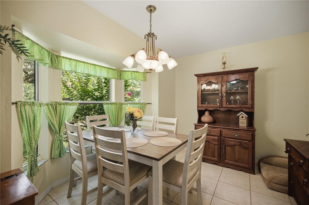 17900 Northwest 120th Avenue Road Reddick, FL 32686 - Photo 41 of 45 a view of a dining room with furniture window and outside view