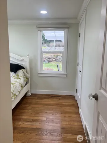 a view of a room that has a bed in it