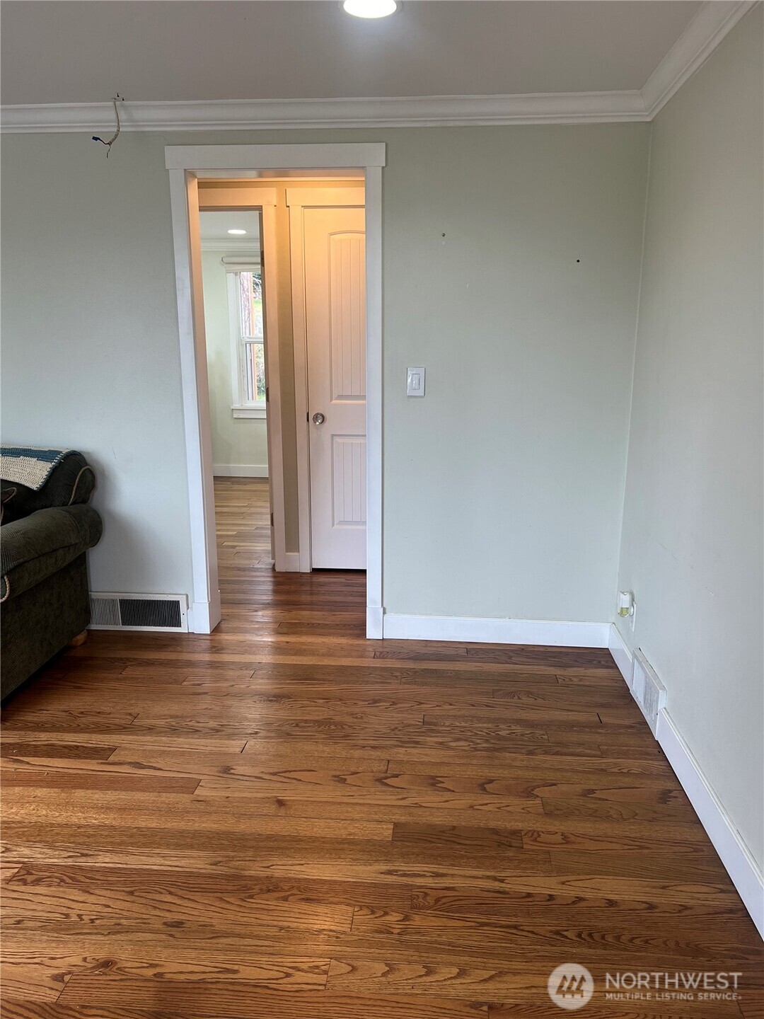 558 Windsor Place Northeast Renton, WA 98056 - Photo 4 of 20 a view of wooden floor and cabinet in a room