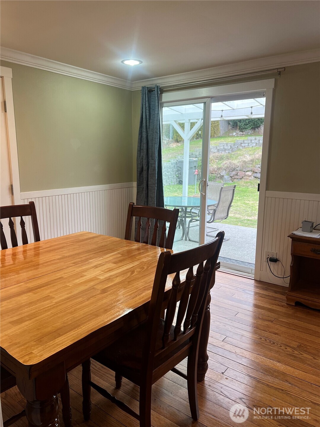 558 Windsor Place Northeast Renton, WA 98056 - Photo 7 of 20 a view of a dining room with furniture window and wooden floor