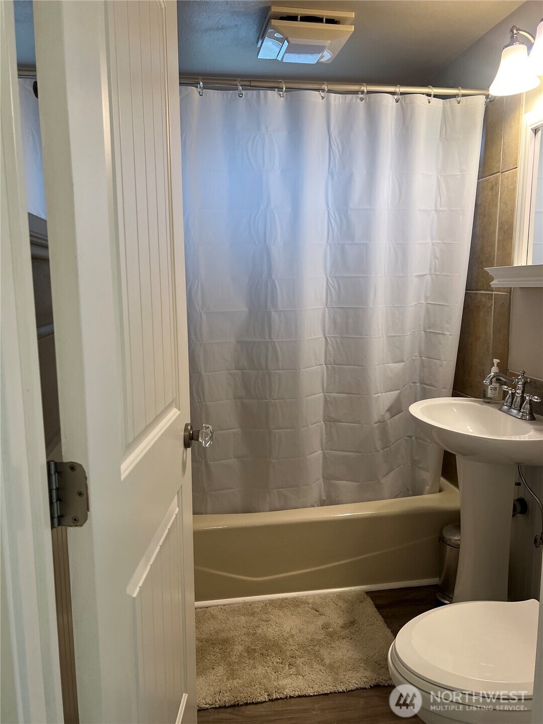 558 Windsor Place Northeast Renton, WA 98056 - Photo 8 of 20 a bathroom with a sink a toilet and shower