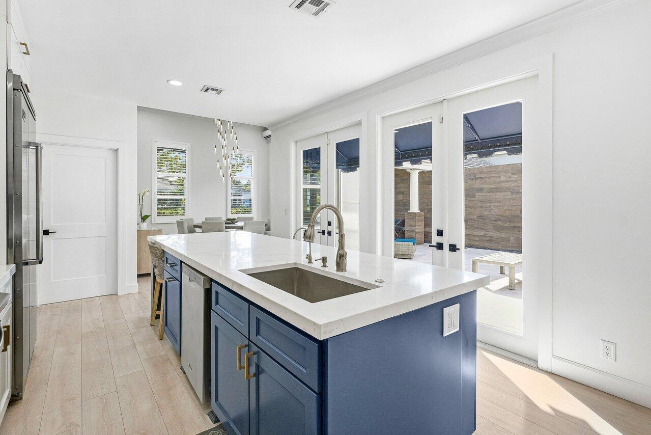 5696 Northwest 39th Avenue Boca Raton, FL 33496 - Photo 6 of 24 a bathroom with a granite countertop sink a mirror and a bathtub