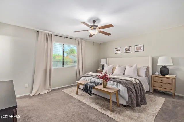 a bedroom with a bed and a window