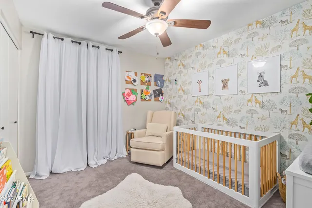 a bedroom with furniture and a window