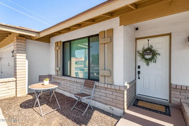 a outdoor living space with furniture and a potted plant