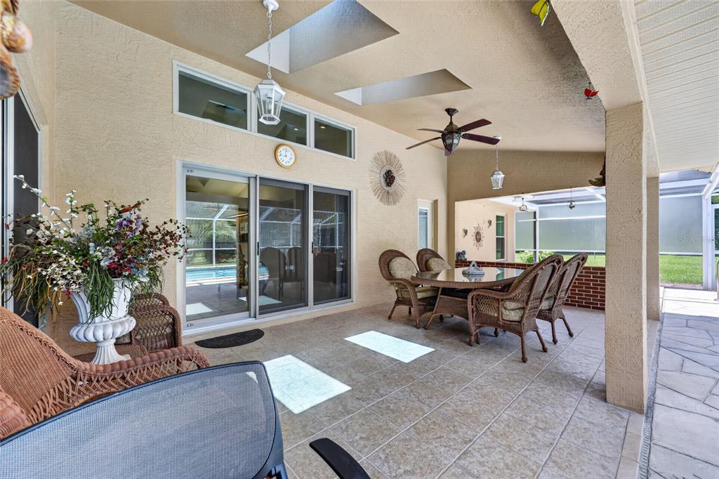 19025 Southwest 98th Loop Dunnellon, FL 34432 - Photo 47 of 80 a dining room with furniture and a large window