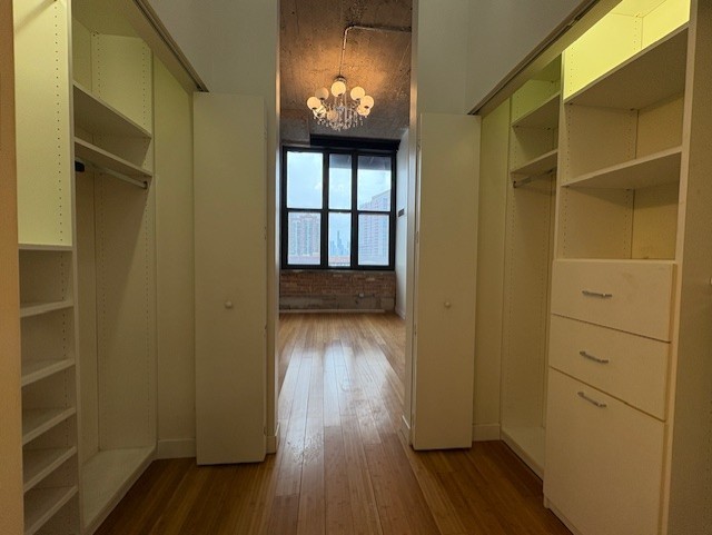 320 East 21st Street, Unit 405 Chicago, IL 60616 - Photo 12 of 15 a view of an empty room and wooden floor and a window