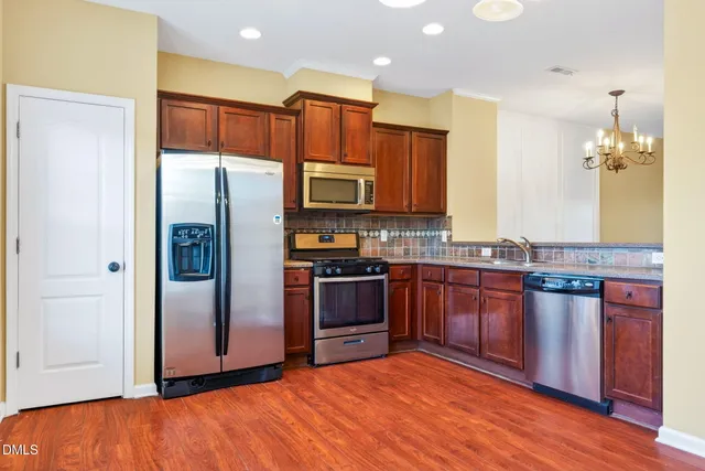 a view of a kitchen with a sink and a kitchen